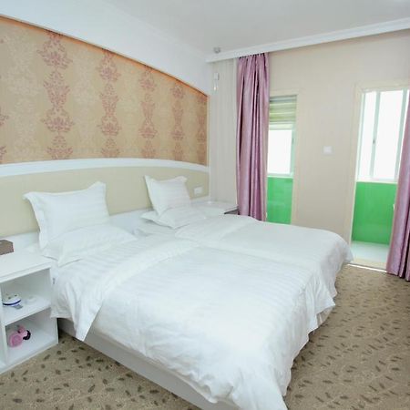 Xinghe Xinfeng Hotel Kanton Pokoj fotografie