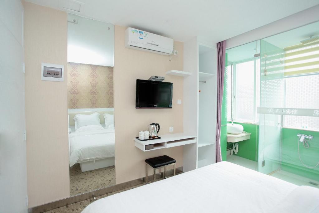 Xinghe Xinfeng Hotel Kanton Pokoj fotografie